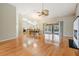 Bright living room with hardwood floors, fireplace, and view to the pool at 1413 Morning Rose Pl, Trinity, FL 34655