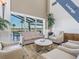 Relax in this comfortable lounge area overlooking the lake at 1413 Morning Rose Pl, Trinity, FL 34655