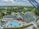 Resort-style pool and clubhouse with expansive patio at 1413 Morning Rose Pl, Trinity, FL 34655