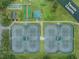 Community tennis courts with surrounding green space at 1413 Morning Rose Pl, Trinity, FL 34655