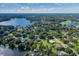 Aerial view of a house on a waterfront lot with a large backyard at 1523 Fishing Lake Dr, Odessa, FL 33556