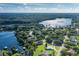Aerial view of a house near Lake Ann with access to the lake at 1523 Fishing Lake Dr, Odessa, FL 33556