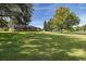 Spacious backyard with lush lawn and home view at 1523 Fishing Lake Dr, Odessa, FL 33556