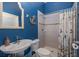 Bathroom with a shower and nautical-themed decor at 1523 Fishing Lake Dr, Odessa, FL 33556