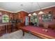Game room featuring a pool table and adjacent wet bar at 1523 Fishing Lake Dr, Odessa, FL 33556