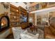 Gathering room with built-in shelving, fireplace, and a large TV at 1523 Fishing Lake Dr, Odessa, FL 33556