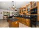 Kitchen boasts an island, wood cabinets, and a breakfast nook at 1523 Fishing Lake Dr, Odessa, FL 33556