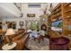 Spacious living room featuring a fireplace and built-in shelving at 1523 Fishing Lake Dr, Odessa, FL 33556