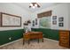 Home office with wood desk, window seat, and built-in shelves at 1523 Fishing Lake Dr, Odessa, FL 33556