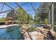 Inviting pool and spa with waterfall feature at 1523 Fishing Lake Dr, Odessa, FL 33556