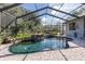 Enjoy this lovely screened pool and waterfall at 1523 Fishing Lake Dr, Odessa, FL 33556