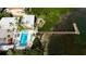 Aerial view of resort showing pool, dock, and waterfront location at 1603 N Gulf N Dr # 30, Bradenton Beach, FL 34217