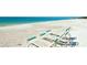 Relaxing beach with lounge chairs and ocean view at 1603 N Gulf N Dr # 30, Bradenton Beach, FL 34217