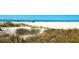 Expansive view of white sand beach with clear water at 1603 N Gulf N Dr # 30, Bradenton Beach, FL 34217