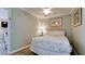 Cozy bedroom with a full-size bed and wicker headboard at 1603 N Gulf N Dr # 30, Bradenton Beach, FL 34217