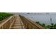 Wooden walkway leading to the waterfront at 1603 N Gulf N Dr # 30, Bradenton Beach, FL 34217