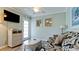 Living room with sofa, wicker furniture, and TV at 1603 N Gulf N Dr # 30, Bradenton Beach, FL 34217