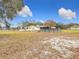 Spacious backyard with above ground pool, detached shed and large grassy area at 18923 Rolling Oak Dr, Hudson, FL 34667