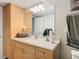 Bathroom with light wood vanity and sink at 18923 Rolling Oak Dr, Hudson, FL 34667