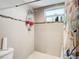 Clean bathroom with shower stall, toilet and storage at 18923 Rolling Oak Dr, Hudson, FL 34667