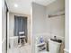 Toilet and small side table in the bathroom at 18923 Rolling Oak Dr, Hudson, FL 34667