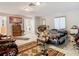 Bedroom with a queen bed, dresser, and access to laundry at 18923 Rolling Oak Dr, Hudson, FL 34667