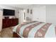 Bedroom with wood dresser, bed, and TV at 18923 Rolling Oak Dr, Hudson, FL 34667