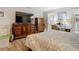 Bedroom with king-size bed and large dresser at 18923 Rolling Oak Dr, Hudson, FL 34667