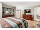 Bedroom with wood furniture and striped bedding at 18923 Rolling Oak Dr, Hudson, FL 34667