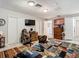 Spacious bedroom with ample closet space and a large TV at 18923 Rolling Oak Dr, Hudson, FL 34667
