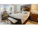 Bright bedroom with a comfortable bed, built-in desk, and ample storage at 18923 Rolling Oak Dr, Hudson, FL 34667