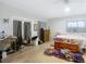 Bright bedroom featuring a comfortable bed, ample storage, and sliding glass doors at 18923 Rolling Oak Dr, Hudson, FL 34667