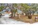 House exterior with a spacious driveway and mature landscaping at 18923 Rolling Oak Dr, Hudson, FL 34667