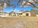 Ranch home with large yard, mature trees and stone accents at 18923 Rolling Oak Dr, Hudson, FL 34667