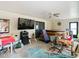 Florida room with large TV and hot tub access at 18923 Rolling Oak Dr, Hudson, FL 34667