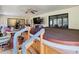 Relaxing hot tub on covered patio with seating area at 18923 Rolling Oak Dr, Hudson, FL 34667