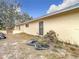 Side view of house with rock feature and small pond at 18923 Rolling Oak Dr, Hudson, FL 34667