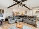 Open concept living room with kitchen views and a large sectional sofa at 18923 Rolling Oak Dr, Hudson, FL 34667