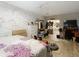 Main bedroom with white brick accent wall and en-suite bathroom at 18923 Rolling Oak Dr, Hudson, FL 34667