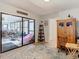 Home office with sliding glass doors leading to a sunroom at 18923 Rolling Oak Dr, Hudson, FL 34667