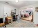 Home office with built-in shelving and access to other rooms at 18923 Rolling Oak Dr, Hudson, FL 34667