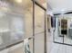 Shower stall with glass door and tiled walls at 18923 Rolling Oak Dr, Hudson, FL 34667