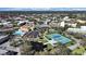 Aerial view of community with tennis courts, pool, and lush landscaping at 2000 World Parkway Blvd # 21, Clearwater, FL 33763