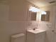 Bathroom with white tile, vanity, and updated fixtures at 2000 World Parkway Blvd # 21, Clearwater, FL 33763