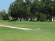 Well-manicured golf course with trees and a putting green at 2000 World Parkway Blvd # 21, Clearwater, FL 33763