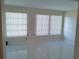 Living room with tile floors and vertical blinds at 2000 World Parkway Blvd # 21, Clearwater, FL 33763