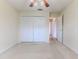 Bedroom with double door closet and carpet flooring at 2217 Terrace View Ln, Spring Hill, FL 34606