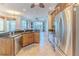 Spacious kitchen with stainless steel appliances and granite countertops at 2217 Terrace View Ln, Spring Hill, FL 34606