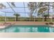 Inviting swimming pool with spa and screened enclosure at 2217 Terrace View Ln, Spring Hill, FL 34606