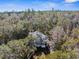 House nestled in lush, wooded surroundings at 22770 Skyview Cir, Brooksville, FL 34602